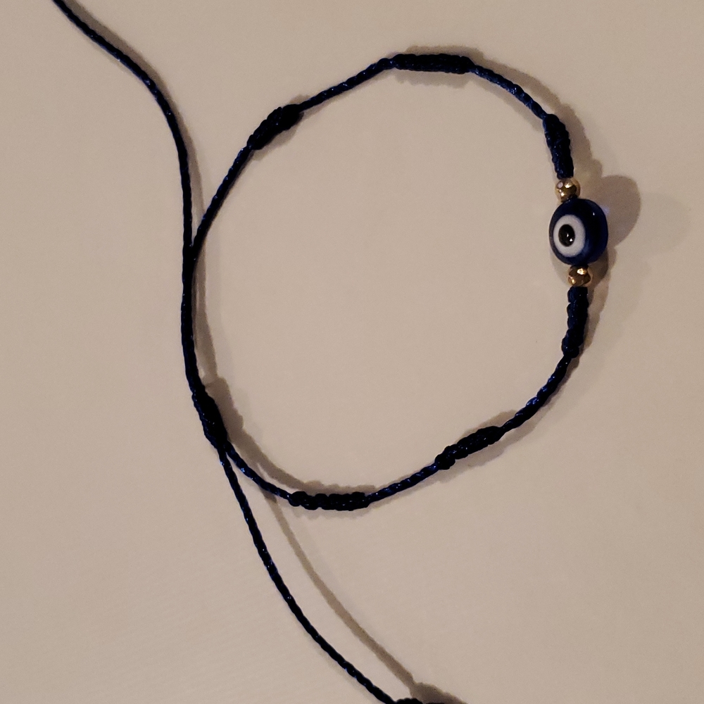 Evil eye bracelet with blue string
